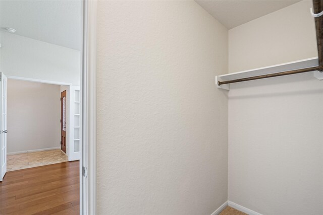 15218 Zenith Glen Ln, Cypress, TX 77429 - walk in closet with wood finished floors