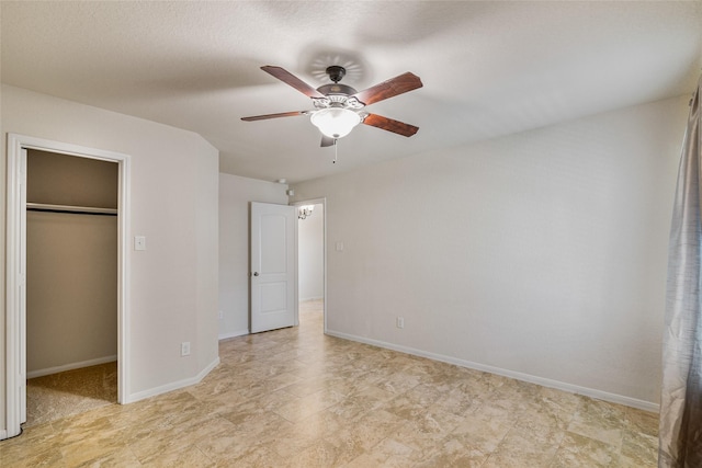 15218 Zenith Glen Ln, Cypress, TX 77429 - unfurnished bedroom with a walk in closet, a closet, and a ceiling fan