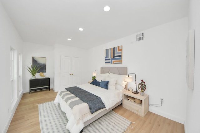 300 Narcissus Rd, Clear Lake Shores, TX 77565 - bedroom with light wood-style flooring, a closet, and recessed lighting