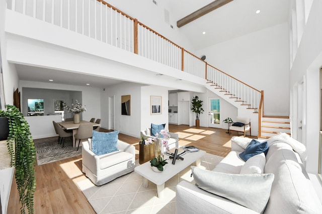 300 Narcissus Rd, Clear Lake Shores, TX 77565 - living area featuring high vaulted ceiling, stairway, light wood-style flooring, beam ceiling, and recessed lighting