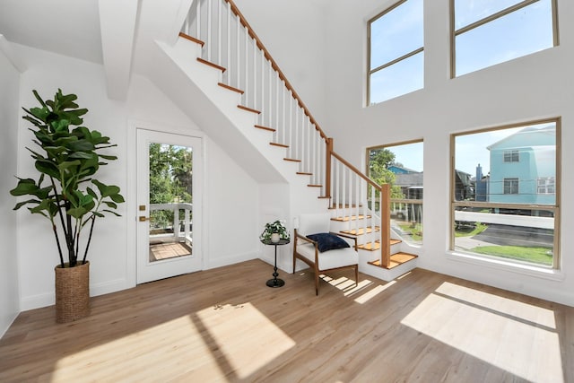 300 Narcissus Rd, Clear Lake Shores, TX 77565 - foyer with wood finished floors, stairs, and a high ceiling