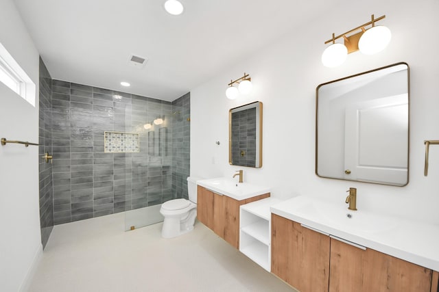 300 Narcissus Rd, Clear Lake Shores, TX 77565 - bathroom featuring a walk in shower, two vanities, and recessed lighting