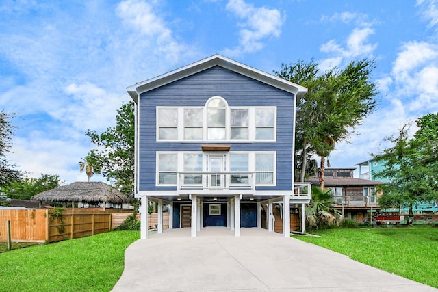 300 Narcissus Rd, Clear Lake Shores, TX 77565 - view of front of home with a carport and concrete driveway