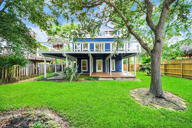 300 Narcissus Rd, Clear Lake Shores, TX 77565 - rear view of house featuring a fenced backyard and a wooden deck