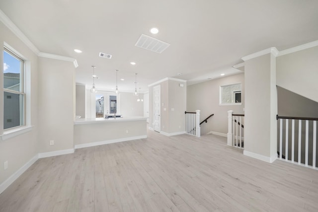 11929 Primrose Creek Trl, Houston, TX 77051 - unfurnished living room featuring light wood-style floors, ornamental molding, healthy amount of natural light, and recessed lighting