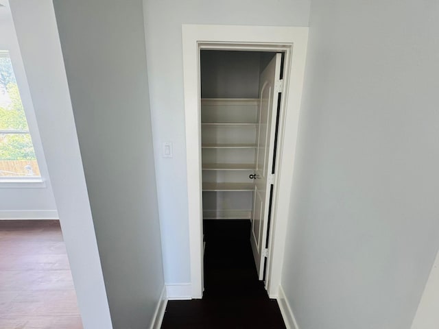 8128 Penrod St, Houston, TX 77028 - hallway featuring dark wood-style flooring