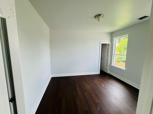 8128 Penrod St, Houston, TX 77028 - spare room with dark wood-style flooring and baseboards