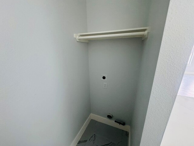 8128 Penrod St, Houston, TX 77028 - washroom featuring hookup for an electric dryer and baseboards