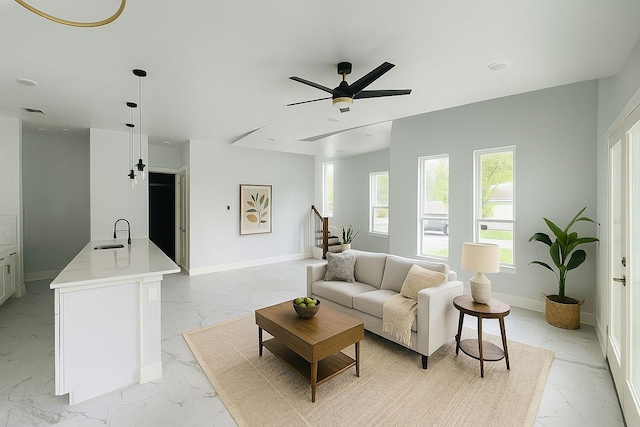 8128 Penrod St, Houston, TX 77028 - living area featuring light marble finish floors and a ceiling fan