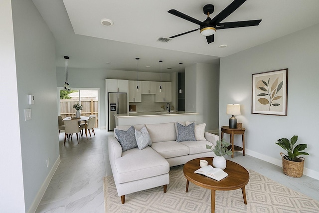 8128 Penrod St, Houston, TX 77028 - living area with light marble finish flooring and a ceiling fan