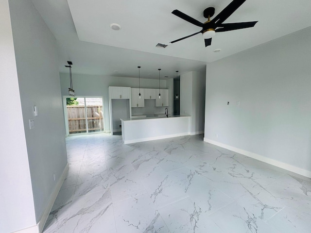 8128 Penrod St, Houston, TX 77028 - unfurnished living room featuring baseboards and a ceiling fan