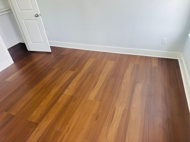 8128 Penrod St, Houston, TX 77028 - unfurnished bedroom with dark wood finished floors