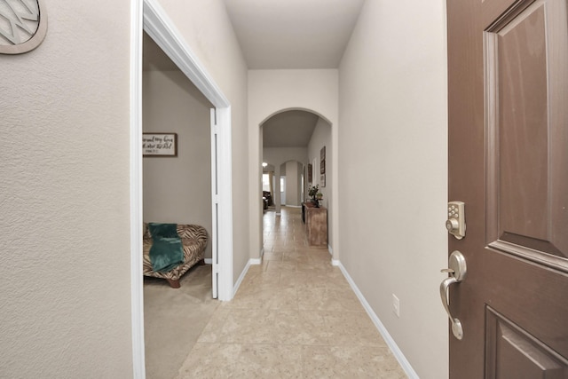 18614 Magnolia Dell Dr, Cypress, TX 77433 - hall featuring arched walkways and light tile patterned floors