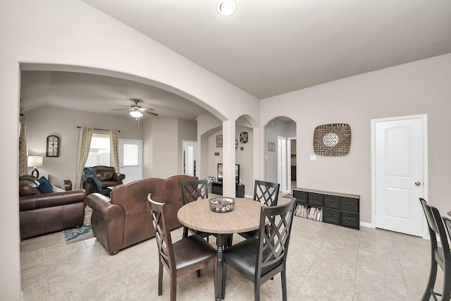 18614 Magnolia Dell Dr, Cypress, TX 77433 - dining space with a ceiling fan, arched walkways, light tile patterned floors, and lofted ceiling