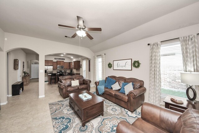 18614 Magnolia Dell Dr, Cypress, TX 77433 - living room with arched walkways, ceiling fan, and lofted ceiling