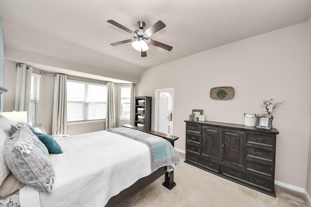 18614 Magnolia Dell Dr, Cypress, TX 77433 - bedroom with light carpet, vaulted ceiling, ceiling fan, and ensuite bath