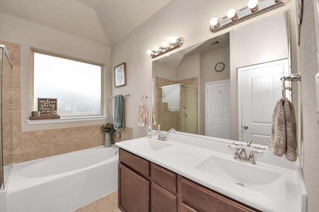 18614 Magnolia Dell Dr, Cypress, TX 77433 - full bathroom with a garden tub, a stall shower, lofted ceiling, and double vanity