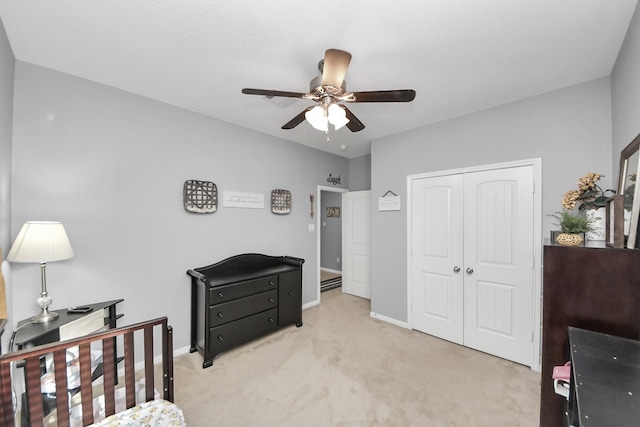 18614 Magnolia Dell Dr, Cypress, TX 77433 - bedroom featuring light carpet, a closet, a desk, and a ceiling fan