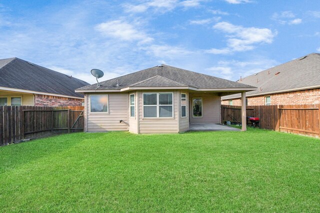 18614 Magnolia Dell Dr, Cypress, TX 77433 - back of property with a fenced backyard, a patio, and roof with shingles