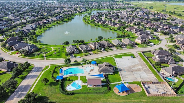 18614 Magnolia Dell Dr, Cypress, TX 77433 - aerial perspective of suburban area with a pool and a large body of water