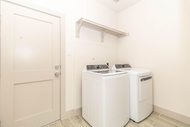 10513 Chesterfield Dr, Houston, TX 77051 - washroom featuring independent washer and dryer and wood finish floors