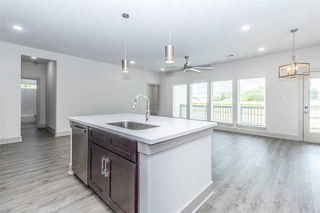 10513 Chesterfield Dr, Houston, TX 77051 - kitchen featuring light countertops, light wood-type flooring, decorative light fixtures, dishwasher, and recessed lighting