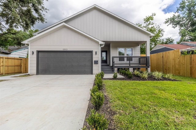 10513 Chesterfield Dr, Houston, TX 77051 - view of front facade with covered porch, driveway, and an attached garage