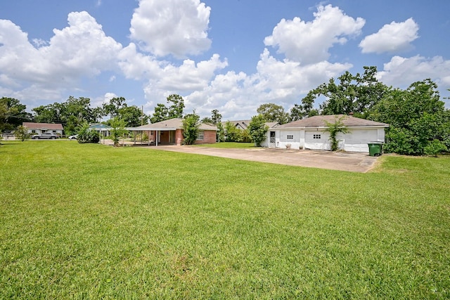 702 Mcdaniel St, Houston, TX 77022 - view of grassy yard with driveway