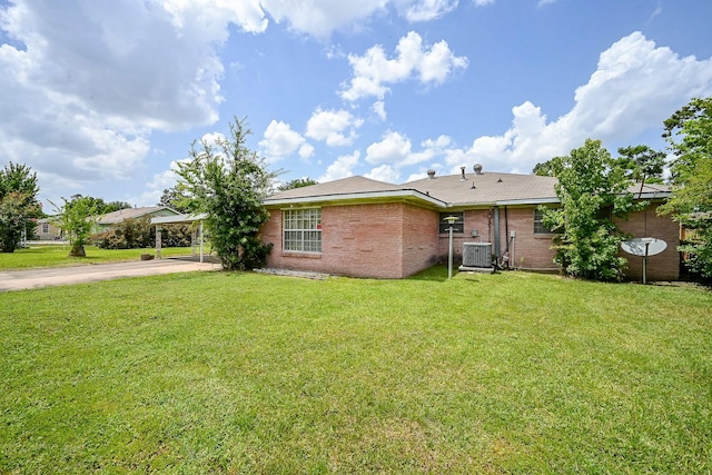 702 Mcdaniel St, Houston, TX 77022 - view of front facade with concrete driveway, a front lawn, brick siding, and an attached carport