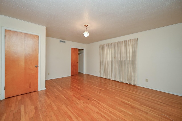 702 Mcdaniel St, Houston, TX 77022 - spare room with light wood-style flooring and baseboards