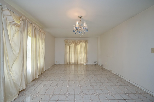 702 Mcdaniel St, Houston, TX 77022 - unfurnished room featuring light flooring and a chandelier