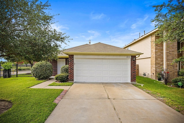 2850 Back Bay Brook Trl, Houston, TX 77045 - view of front facade with driveway, a garage, a shingled roof, and brick siding