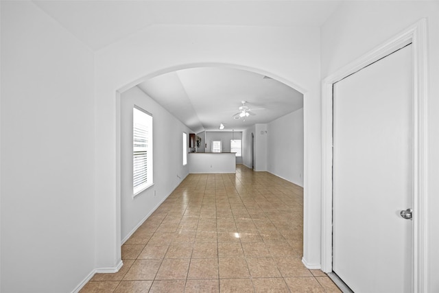 2850 Back Bay Brook Trl, Houston, TX 77045 - hallway with arched walkways and light tile patterned floors