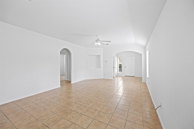2850 Back Bay Brook Trl, Houston, TX 77045 - unfurnished room featuring arched walkways, a ceiling fan, and light tile patterned flooring