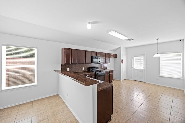 2850 Back Bay Brook Trl, Houston, TX 77045 - kitchen featuring black appliances, light tile patterned floors, backsplash, decorative light fixtures, and a peninsula