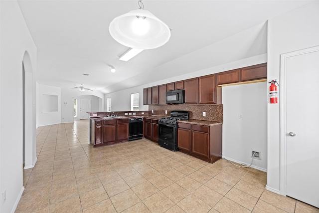 2850 Back Bay Brook Trl, Houston, TX 77045 - kitchen with black appliances, lofted ceiling, ceiling fan, arched walkways, and light tile patterned floors