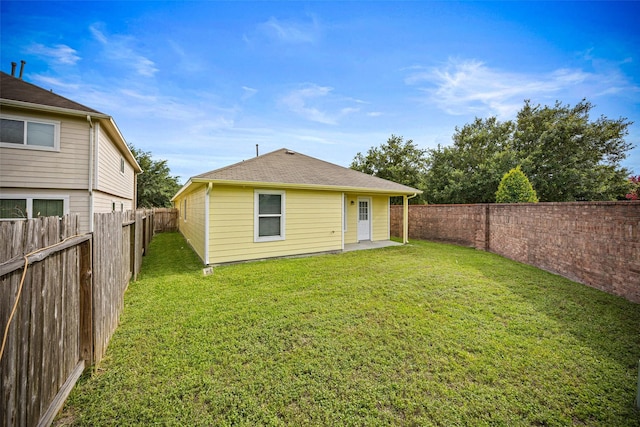 2850 Back Bay Brook Trl, Houston, TX 77045 - back of house with a fenced backyard and a shingled roof