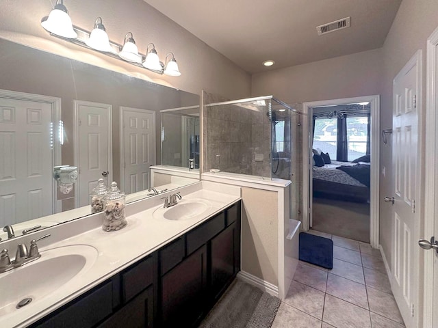17410 Sandalisle Ln, Richmond, TX 77407 - ensuite bathroom featuring a stall shower, double vanity, and tile patterned floors