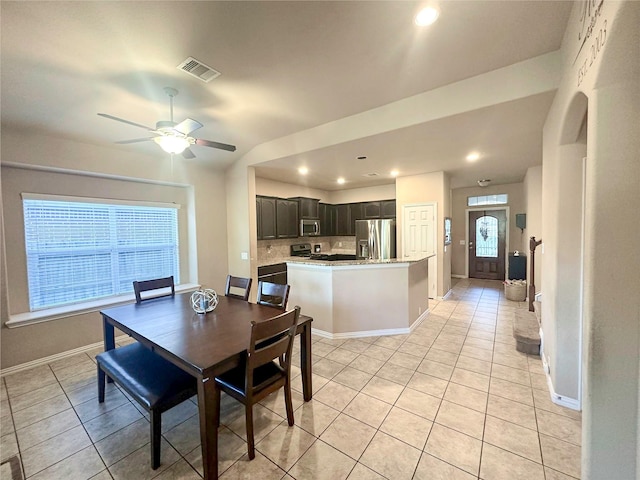 17410 Sandalisle Ln, Richmond, TX 77407 - dining room with light tile patterned flooring, a ceiling fan, and recessed lighting