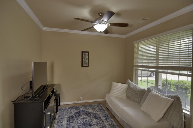 17410 Sandalisle Ln, Richmond, TX 77407 - living area featuring a ceiling fan and crown molding