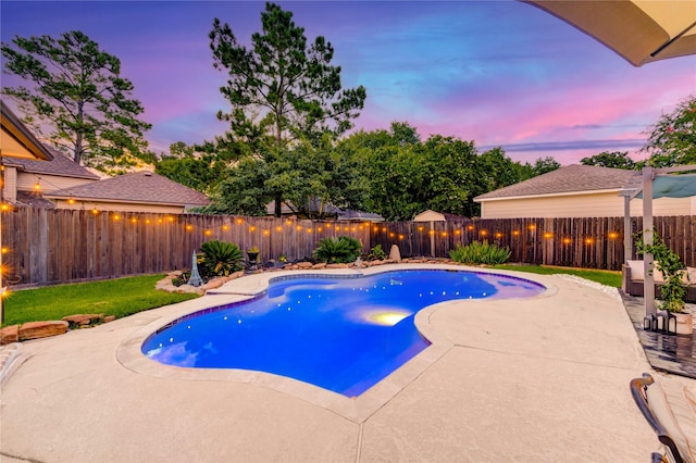 5631 Spring Lodge Dr, Houston, TX 77345 - pool at dusk with a patio area and a fenced backyard