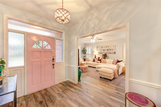 5631 Spring Lodge Dr, Houston, TX 77345 - entryway featuring wood finished floors, a chandelier, and ceiling fan