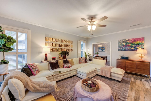 5631 Spring Lodge Dr, Houston, TX 77345 - living room with wood finished floors, crown molding, and a ceiling fan