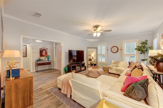 5631 Spring Lodge Dr, Houston, TX 77345 - living area featuring ornamental molding, light wood finished floors, and ceiling fan