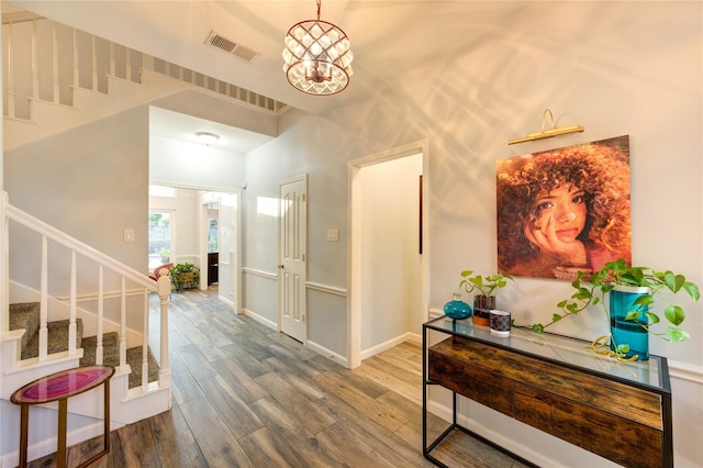 5631 Spring Lodge Dr, Houston, TX 77345 - entrance foyer with stairs, wood finished floors, and a chandelier