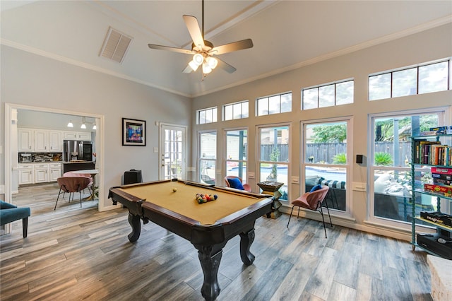 5631 Spring Lodge Dr, Houston, TX 77345 - rec room with billiards, light wood-style floors, ornamental molding, a ceiling fan, and a high ceiling