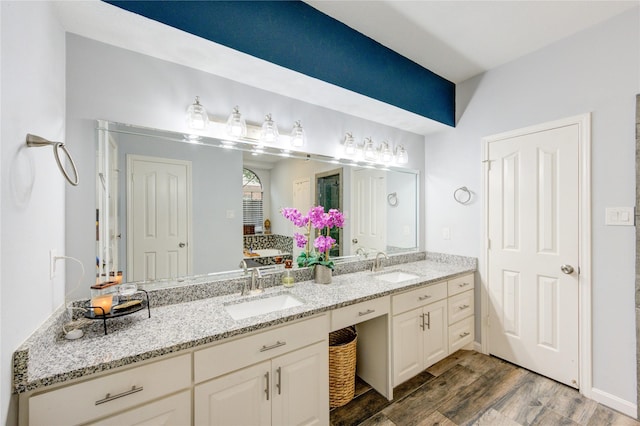 5631 Spring Lodge Dr, Houston, TX 77345 - full bathroom with wood finished floors and double vanity