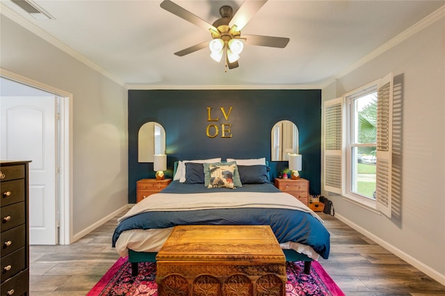 5631 Spring Lodge Dr, Houston, TX 77345 - bedroom featuring multiple windows, crown molding, wood finished floors, and a ceiling fan