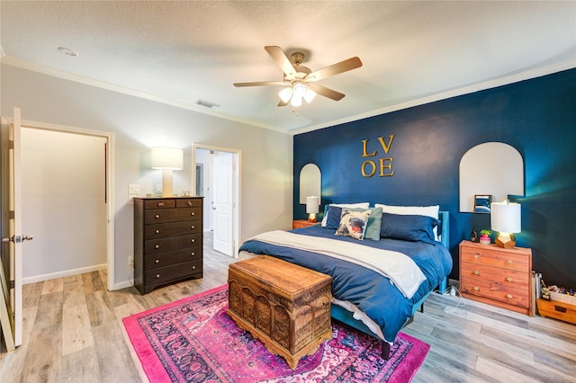 5631 Spring Lodge Dr, Houston, TX 77345 - bedroom featuring light wood-style floors, ornamental molding, and ceiling fan