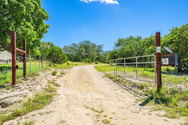 172 Candy Rd, Pipe Creek, TX 78063 - view of street featuring a gate and a gated entry